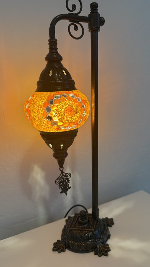 Amber Glow Scroll-Arm Lamp, lit
